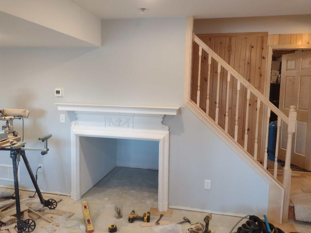 Finished staircase with crisp white trim and dark stair treads